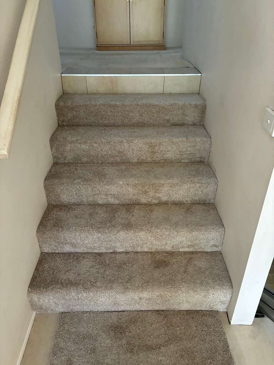 Stairs carpet on tile